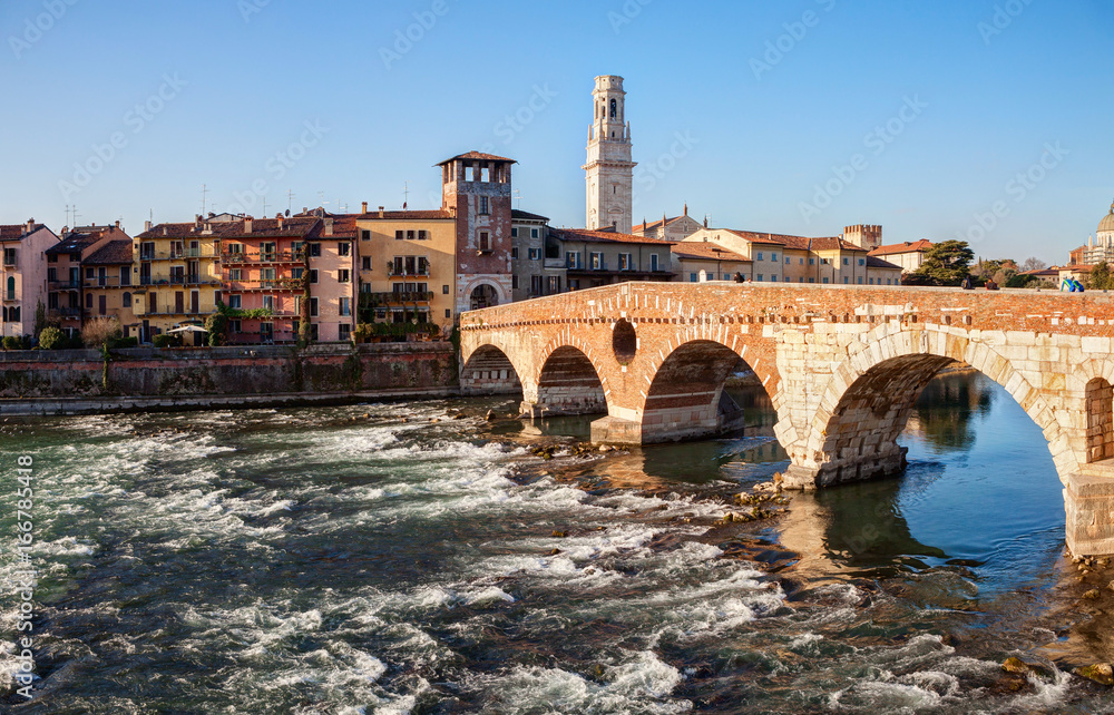 Ponte Pietra (Pons Marmoreus) and the River Adige  at  sunny morning, Verona, Italy.