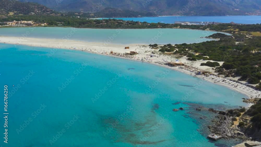 Scenic Sardinia Italy Mediterranean Sea Overlook with Clear Blue Water Bay Sandy Beach and Tourists Scenic Sardinia Italy Mediterranean Sea Overlook with Clear Blue Water Bay Sandy Beach and Tourists