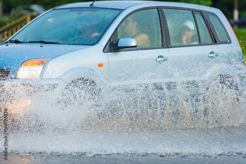car rain puddle splashing water © dbrus