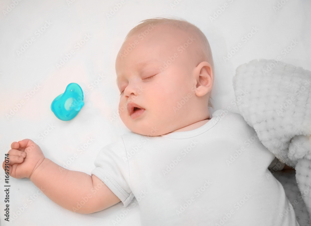 Adorable baby sleeping in cradle at home Adorable baby sleeping in cradle at home