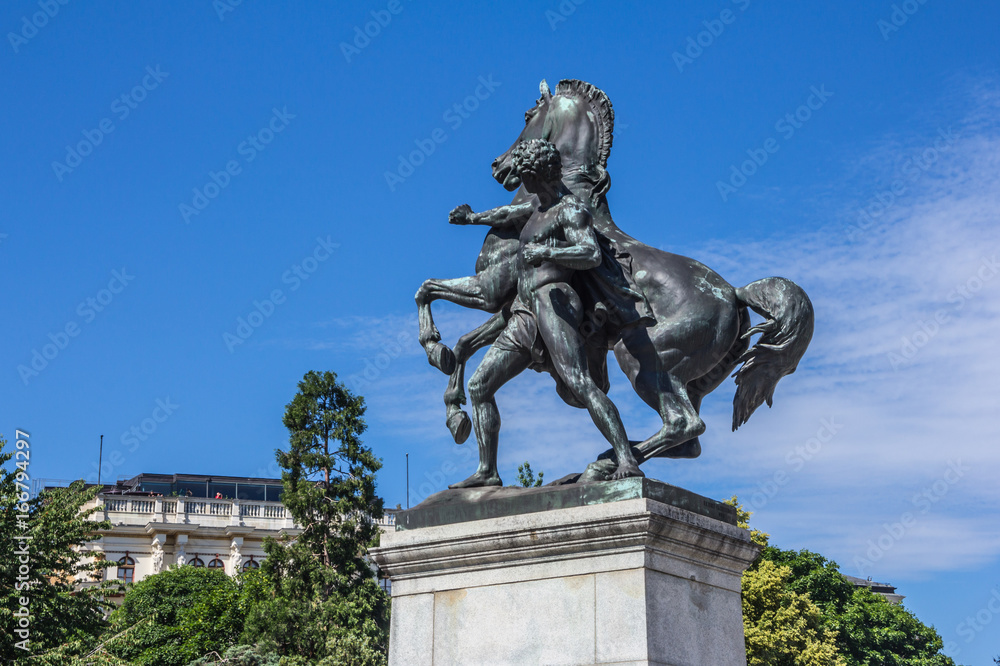 Bronze horse tamer  in front of Austrian parliament building in Vienna, Austria.