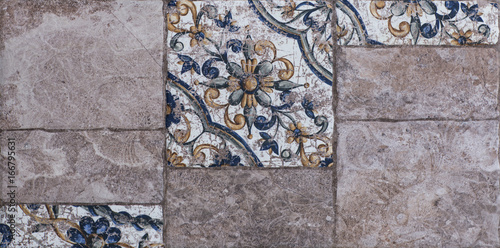 Abstract, geometric, tiled pattern of solid stone