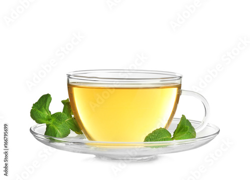 Cup of hot aromatic tea with lemon balm on white background