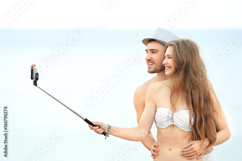 Happy couple taking selfie ...