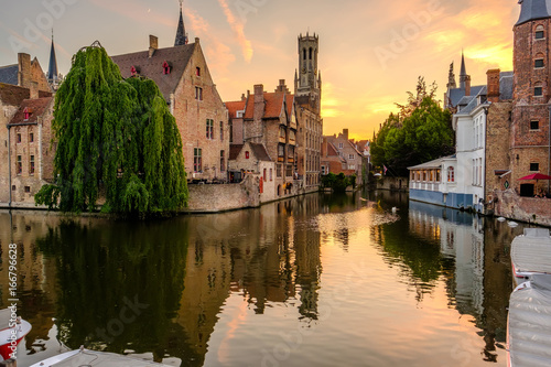 Slika na platnu Bruges (Brugge) cityscape with water canal at sunset