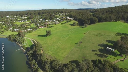 Cinematic round aerial pan across Mallacoota town and Wallagaraugh river in Australia photo