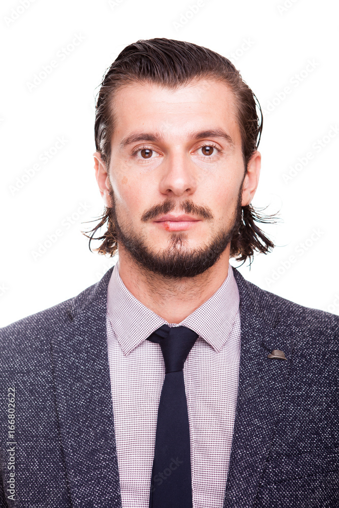 Confident smiling businessman in formal wear isolated over white background in studio photo Confident smiling businessman in formal wear isolated over white background in studio photo