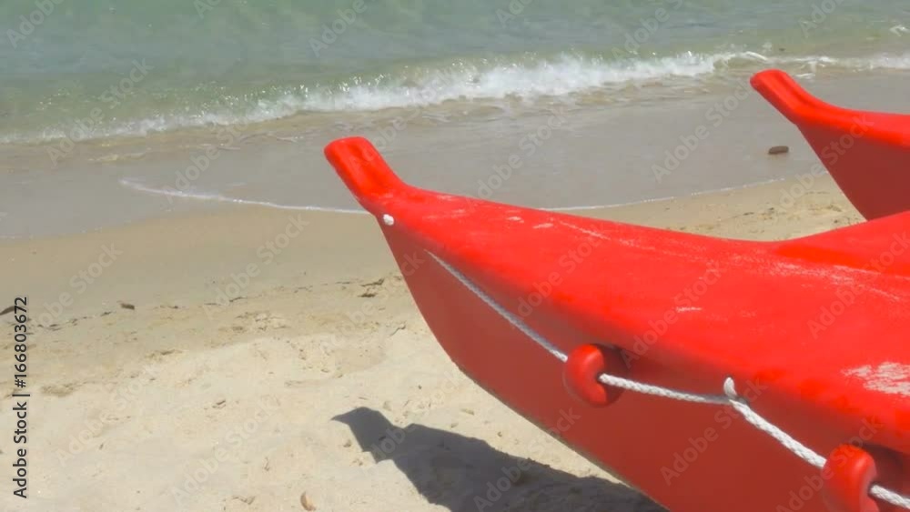 Small Rowing Lifeguard Boat on a Wild Beach in Sardinia Italy in a Windy Day Small Rowing Lifeguard Boat on a Wild Beach in Sardinia Italy in a Windy Day