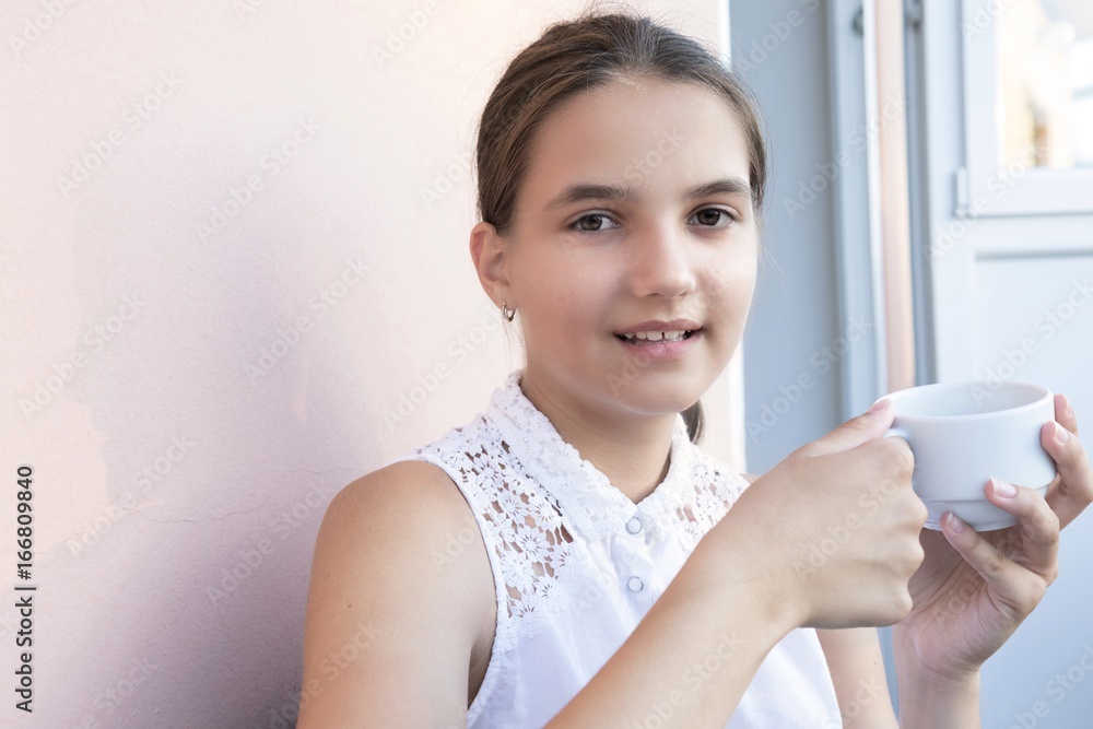Portrait of pretty young woman holding a coffee cup Portrait of pretty young woman holding a coffee cup