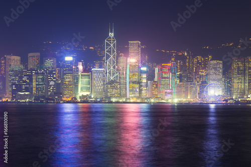 Cityscape and skyline at Victoria Harbour in Hong Kong city at night time.