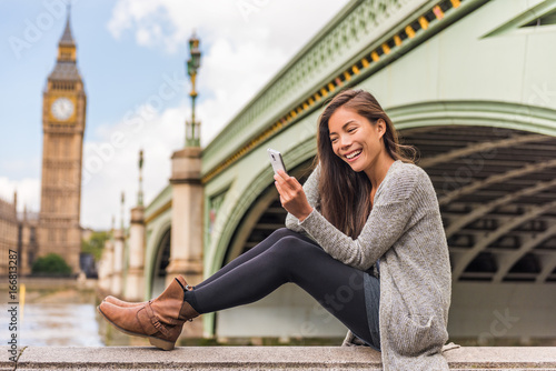 Photography London urban people city lifestyle woman using phone app texting sms on social media