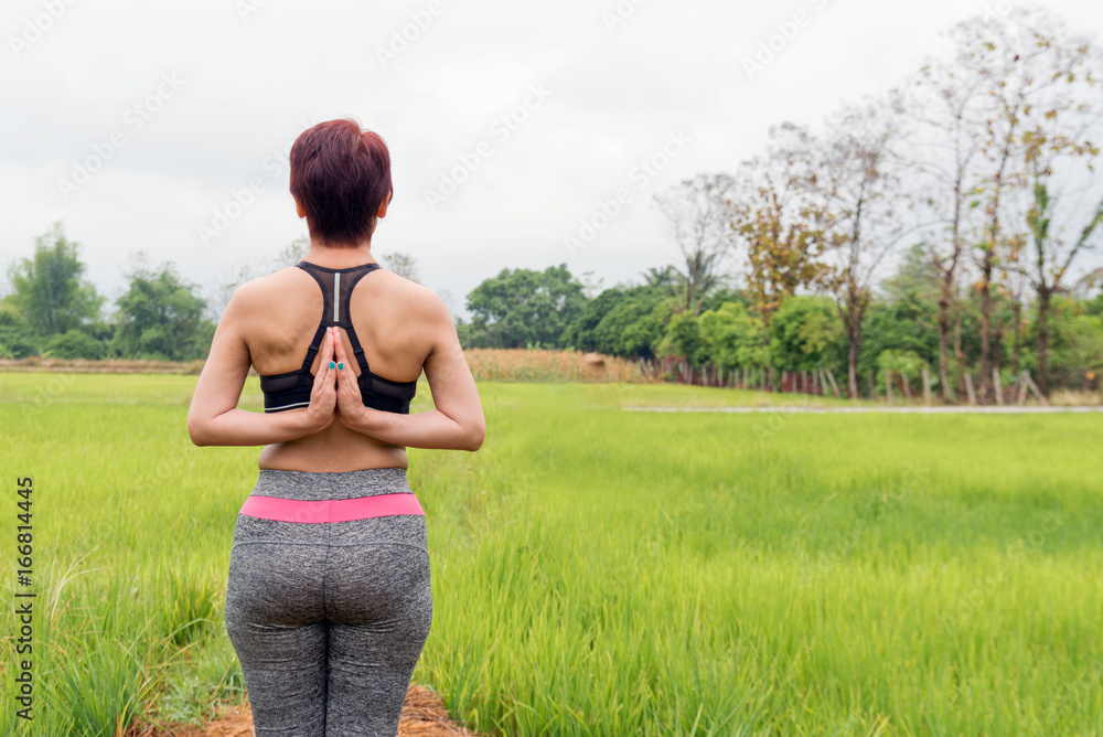 Yoga woman outdoor, green nature