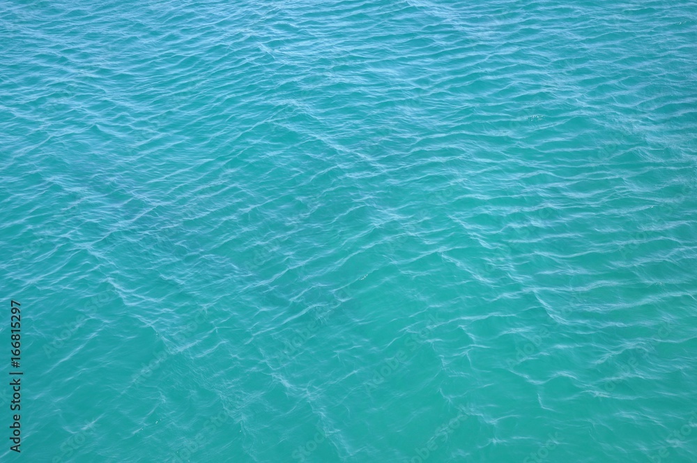 Turquoise blue clean empty sea ocean water surface texture