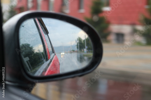 View in side mirror of car © ok_fotoday