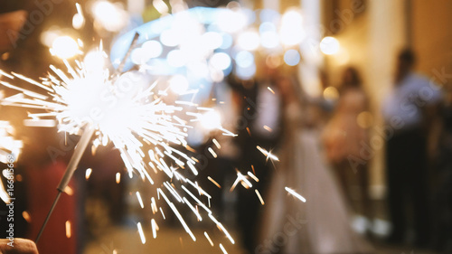 Fotografering Fireworks in hands of guests - wedding evening
