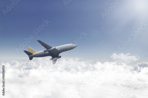 Airplane flying over beautiful clouds