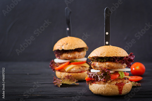 Big hamburger - Sandwich with chicken burger, cheese, onions, tomatoes and lettuce