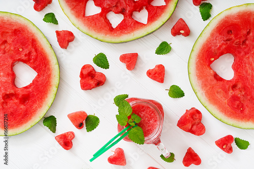 Fresh watermelon smoothies with mint on white wooden background. Flat lay. Top view