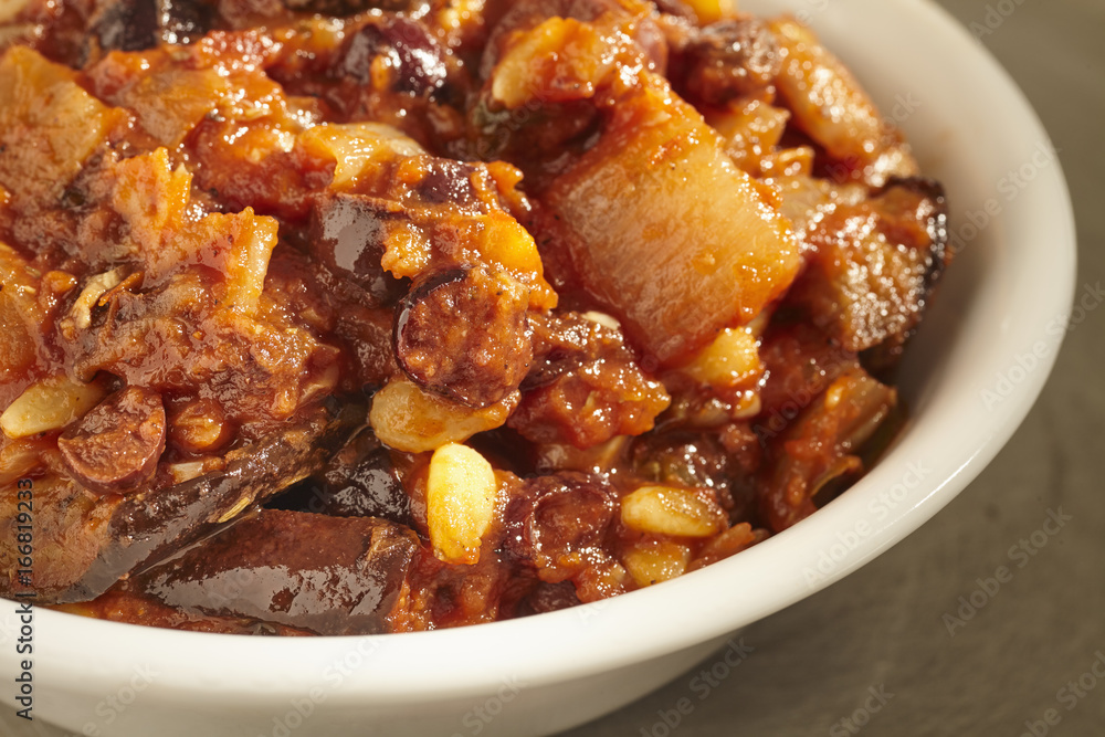 Caponata, a stew of eggplant, tomato, raisins and pine nuts, from Sicily, Italy Caponata, a stew of eggplant, tomato, raisins and pine nuts, from Sicily, Italy