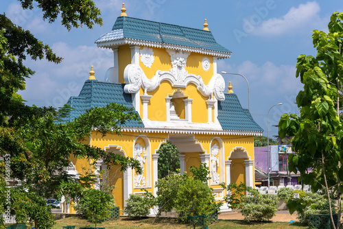 Portal and entrance of pilgrimage site, sanctuary with Buddhist monastery and Hindu temple in one place. The city of Gods, Uthpalawanna Sri Vishnu Devalaya in the small town Dondra, Sri Lanka photo