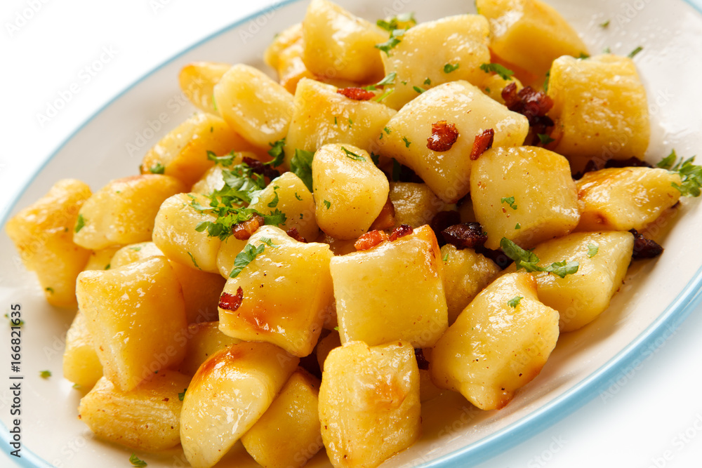 Potato noodles - dumplings on white background Potato noodles - dumplings on white background