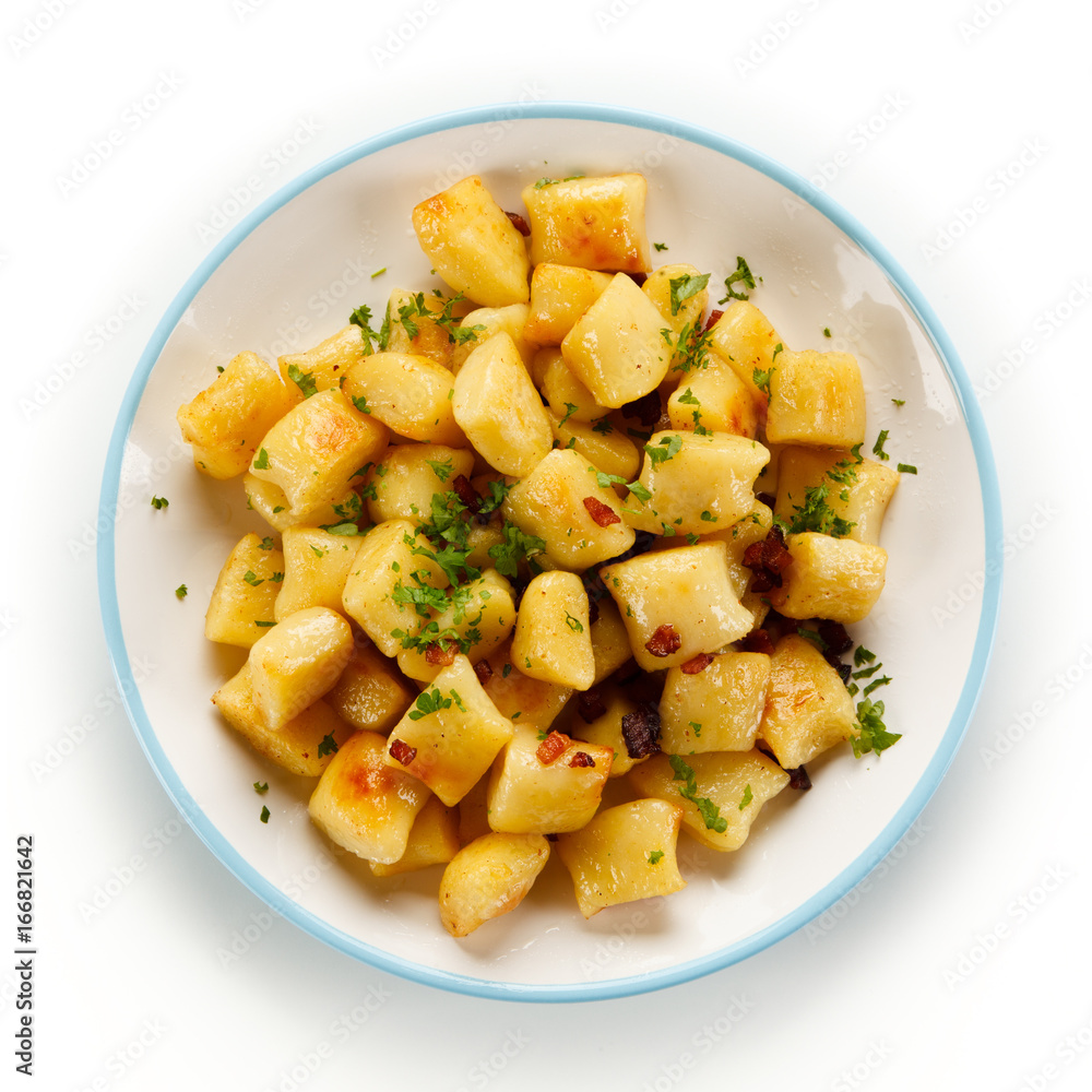 Potato noodles - dumplings on white background Potato noodles - dumplings on white background