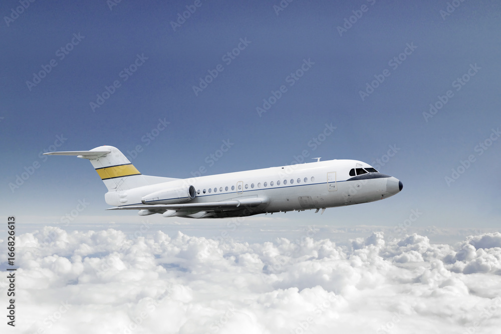 Fototapeta premium Commercial airplane flying in the blue sky