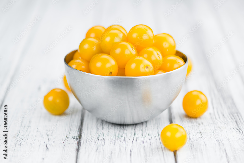 Wooden table with Yellow Tomatoes, selective focus Wooden table with Yellow Tomatoes, selective focus