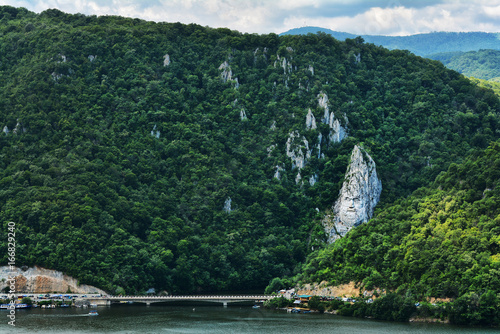 Spectacular Danube Gorges, also known as The Danube Boilers ,passing through the Carpathian Mountains, between Serbia and Romania. Decebal's Head sculpted in rock. photo