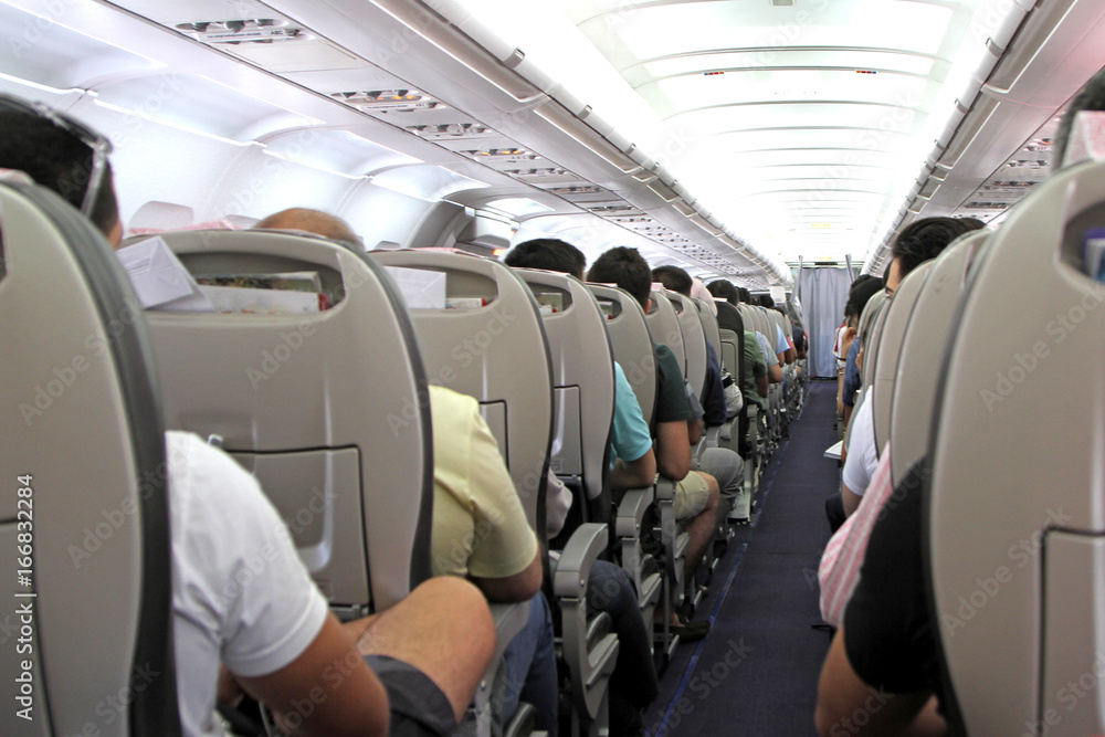 Obraz premium Airplane inside and passengers 