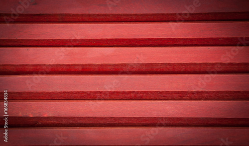 Red wooden horizontal planks background. Vignette
