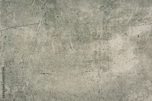 Old concrete wall with cracks - vintage grunge toned background, texture