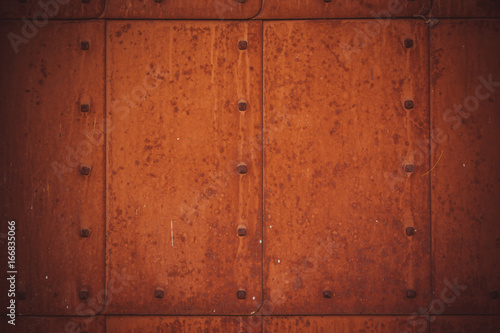 Old rusty metal background with rivets - grunge vintage texture © Stanislav Ostranitsa