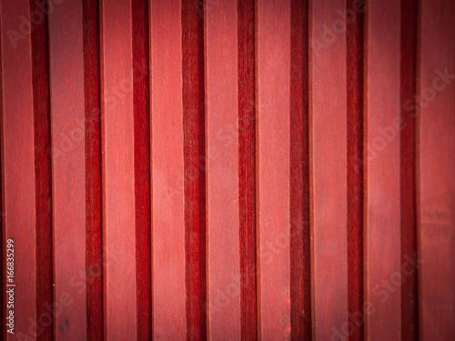 Red wooden vertical planks background. Vignette.