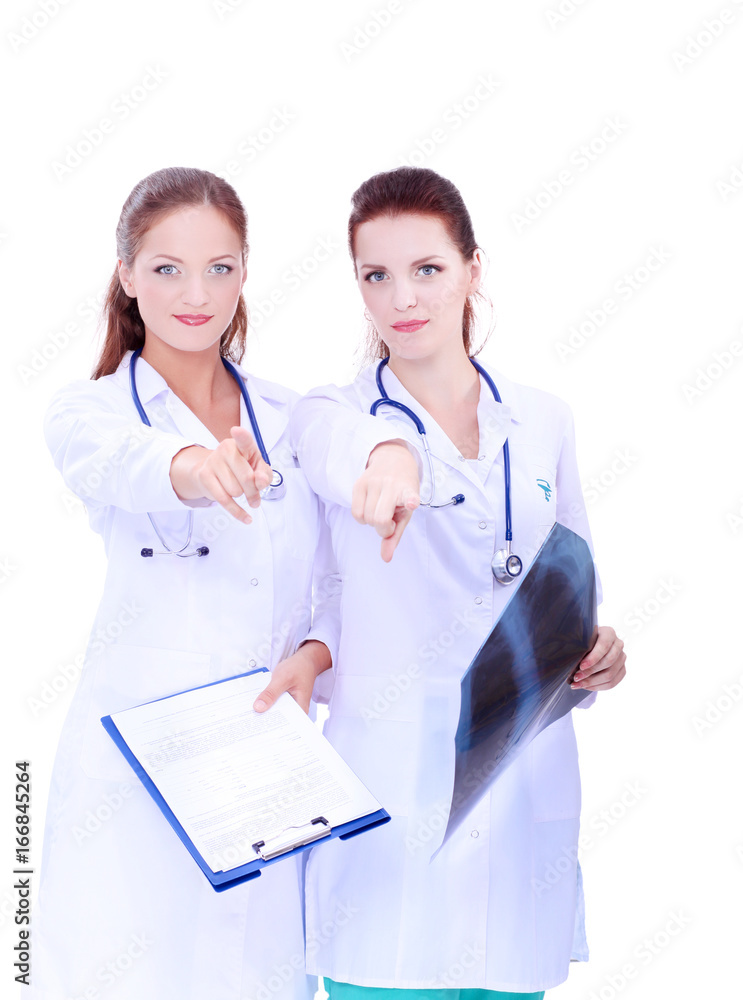 Two woman nurse watching X Ray image, standing in hospital Two woman nurse watching X Ray image, standing in hospital