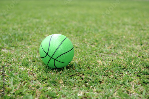 green plastic ball ball on the grass.
