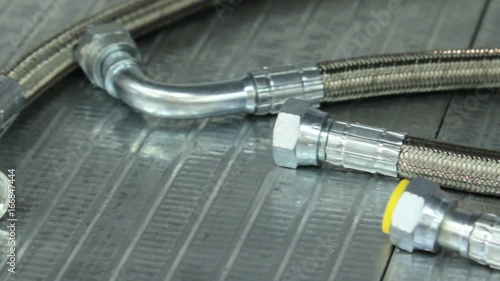 New braided metal hoses. high-pressure hoses. Hydraulic metal hose.