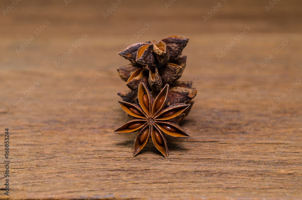 Star anise on wooden board background Star anise on wooden board background