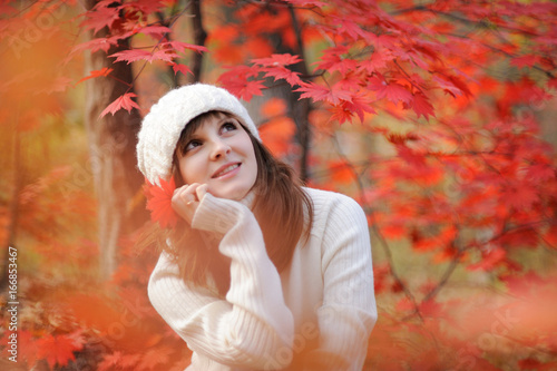 Young pretty woman in the autumn park