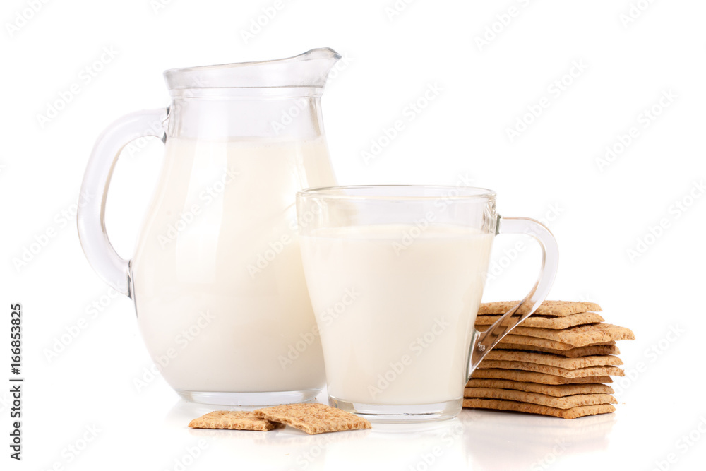 jug and glass of milk with stack of grain crispbreads isolated on white background jug and glass of milk with stack of grain crispbreads isolated on white background