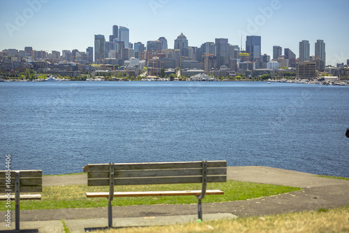Sun over Seattle, park bench in the foreground