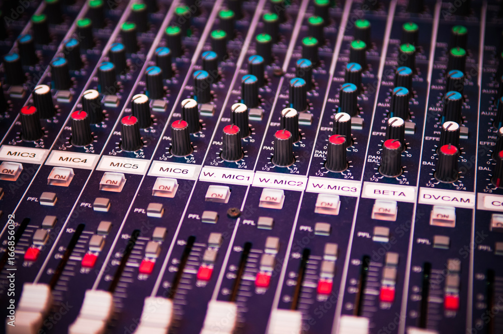 Sound mixer board close up shot.