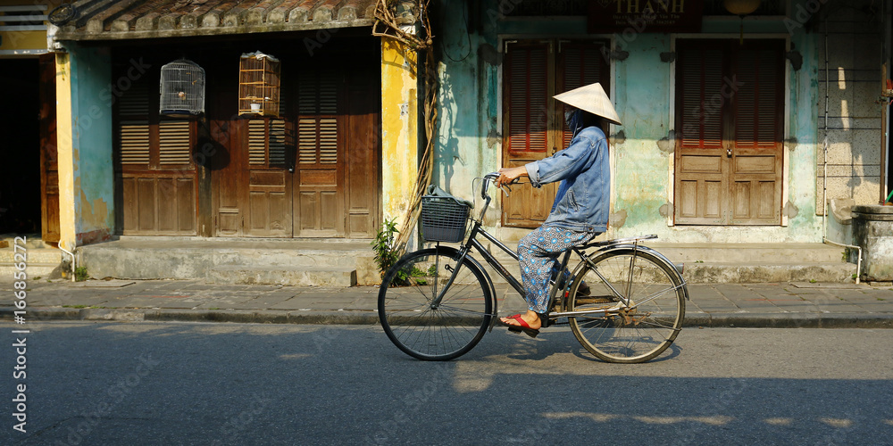 riding bicycle in the street of hoi an in vietnam riding bicycle in the street of hoi an in vietnam