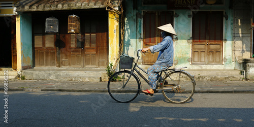 Photography riding bicycle in the street of hoi an in vietnam