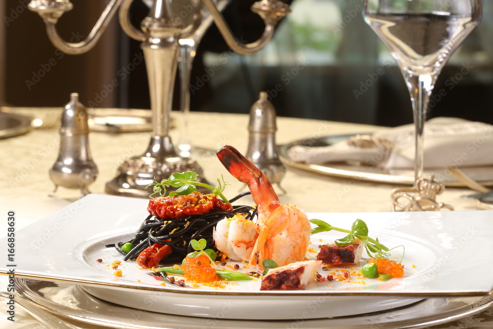 Fine dining - spaghetti nero with seafood and orange Fine dining - spaghetti nero with seafood and orange