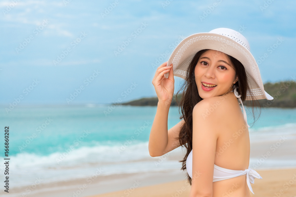 beautiful asian tourist wearing white sexy bikini