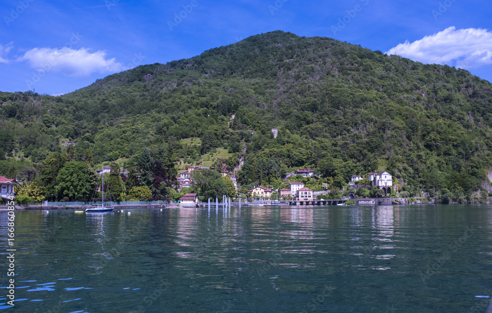 Fototapeta premium The pier and the pilgrimage church Madonna della Punta in Maccagno on Lake Maggiore - Maccagno, Lake Maggiore, Varese, Lombardy, Italy