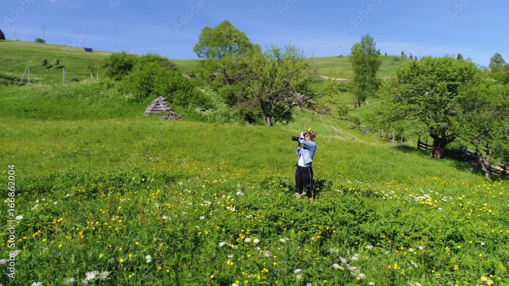 Photographer woman walking, spring day in forest Photographer woman walking, spring day in forest