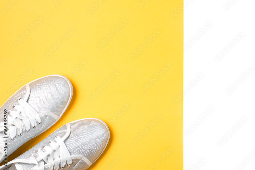 Woman sport shoes close up on a bright background, top view Woman sport shoes close up on a bright background, top view