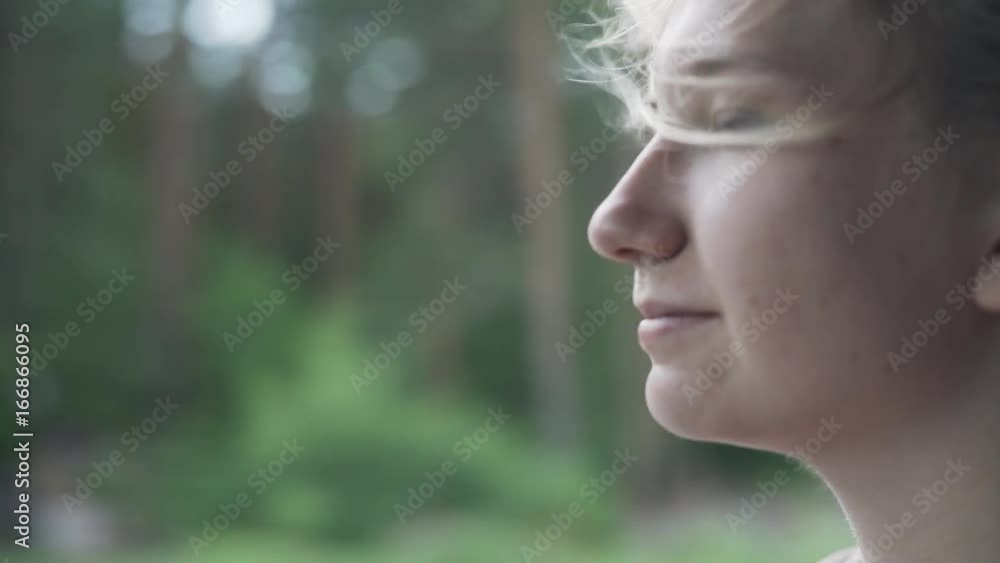 handheld shot of happy teen girl enjoys wind in summer day traveling in car handheld shot of happy teen girl enjoys wind in summer day traveling in car